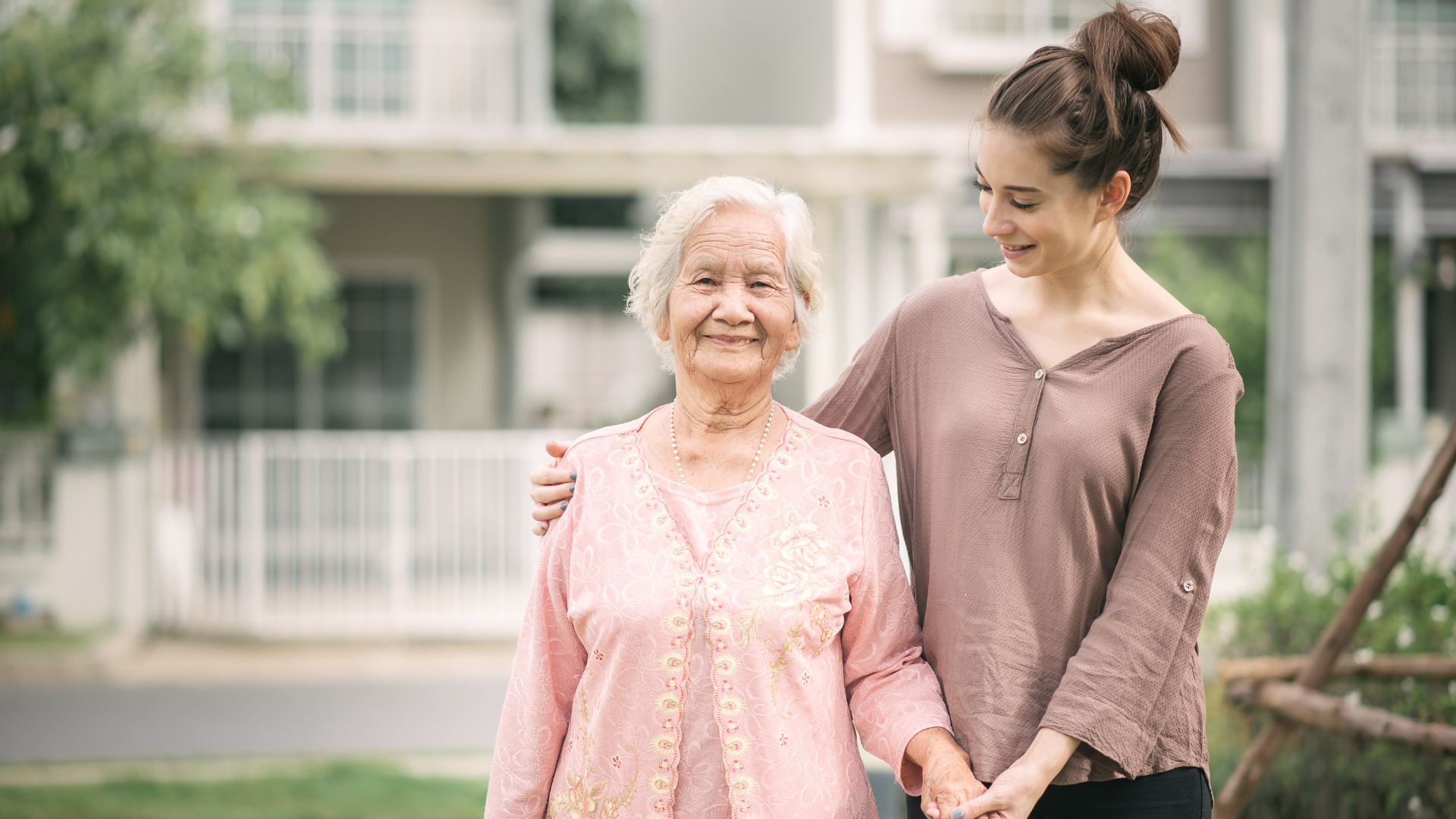 Care provider sharing a warm moment with an older adult at home